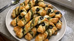 Savory Puff Pastry Candy Cane Twists with Ricotta, Pesto, and Olives